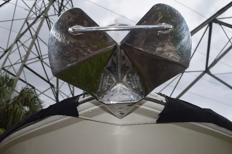 Slide: The Image of 2003 Scout 242 Sportfish boat interior with cushioned seating and rod holders. - 48