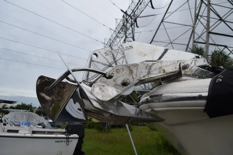 Slide: The Image of 2003 Scout 242 Sportfish boat with Suzuki outboard motor, viewed from the rear. - 50