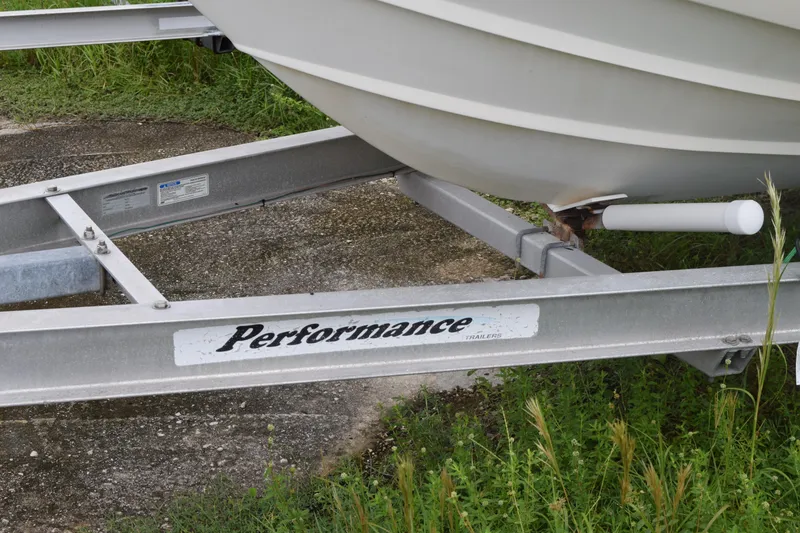 Slide: The Image of Open storage compartment on 2003 Scout 242 Sportfish boat with speakers visible. - 52