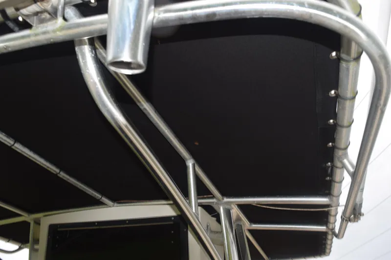 Slide: The Image of 2003 Scout 242 Sportfish boat seat with brown and beige cushions. - 53