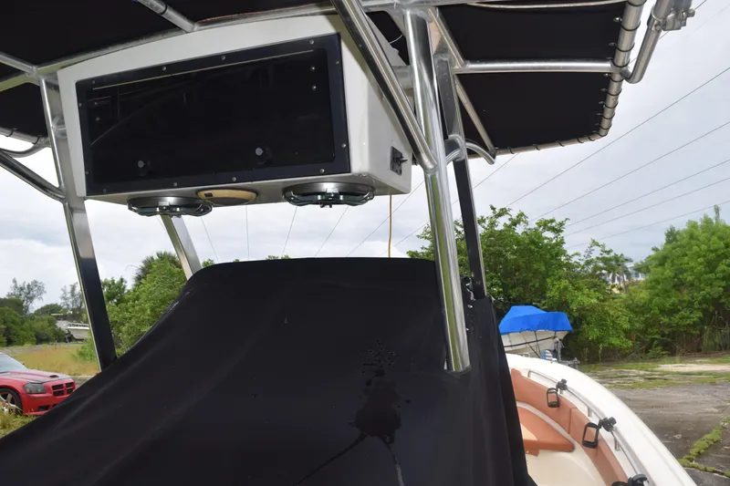 Slide: The Image of 2003 Scout 242 Sportfish boat seat with brown and beige upholstery. - 54