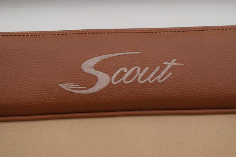 Slide: The Image of Brown leather seat with "Scout" logo, 2003 Scout 242 Sportfish boat. - 57