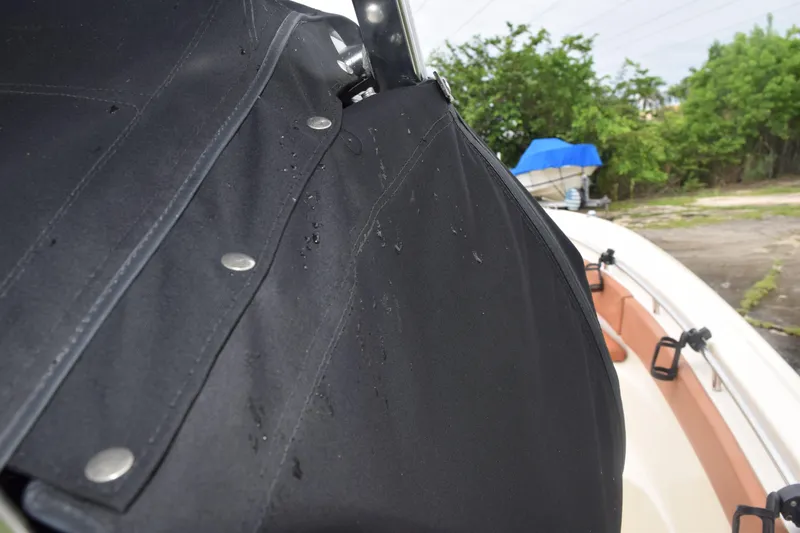 Slide: The Image of 2003 Scout 242 Sportfish boat detail with speakers and light under canopy. - 59