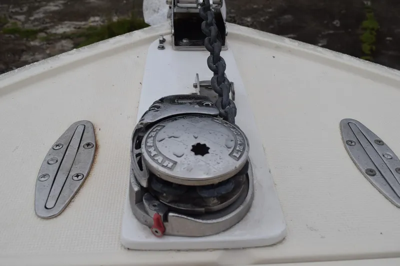 Slide: The Image of 2003 Scout 242 Sportfish interior with speaker and brown seat detail. - 64