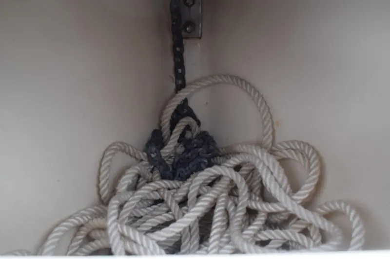 Slide: The Image of 2003 Scout 242 Sportfish boat interior with storage compartment and seating. - 68