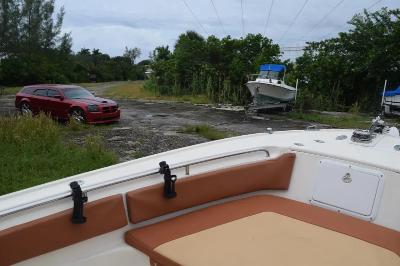 Slide: The Image of Storage drawers on a 2003 Scout 242 Sportfish boat, featuring three compartments. - 74