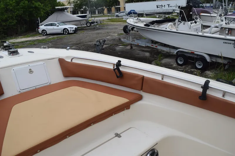 Slide: The Image of Storage drawers on a 2003 Scout 242 Sportfish boat, featuring three white compartments. - 75