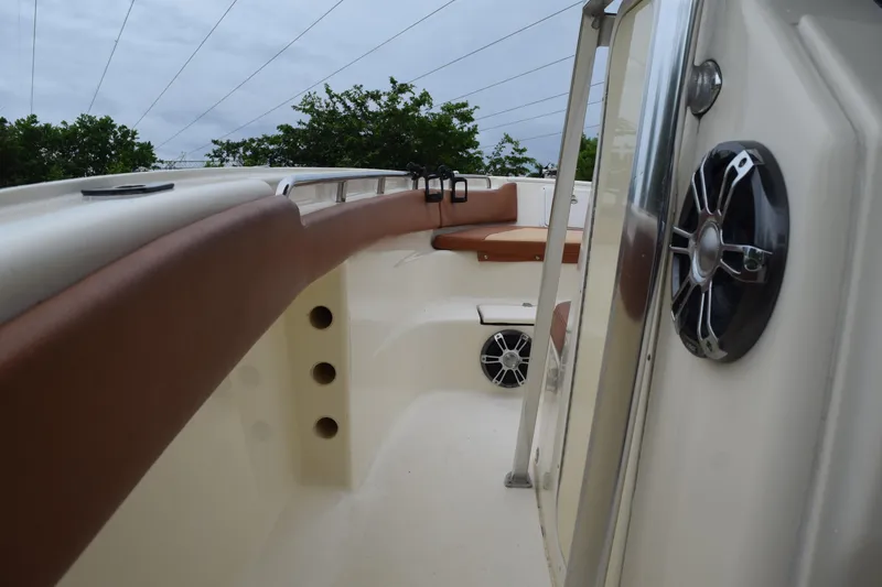 Slide: The Image of 2003 Scout 242 Sportfish boat interior with storage compartment and seating. - 78