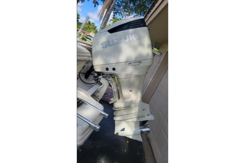 Slide: The Image of Close-up of a 2003 Scout 242 Sportfish boat part with power lines reflection. - 8
