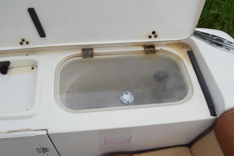 Slide: The Image of Open storage compartment on a 2003 Scout 242 Sportfish boat. - 81