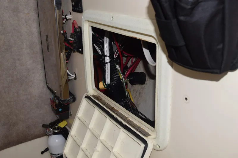 Slide: The Image of 2003 Scout 242 Sportfish boat speakers and electronics compartment. - 91