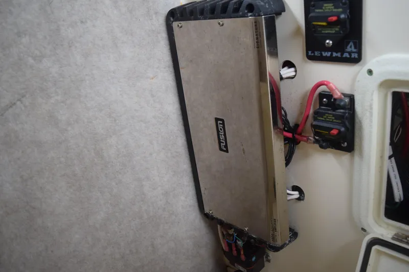 Slide: The Image of 2003 Scout 242 Sportfish helm with steering wheel and control panel. - 97