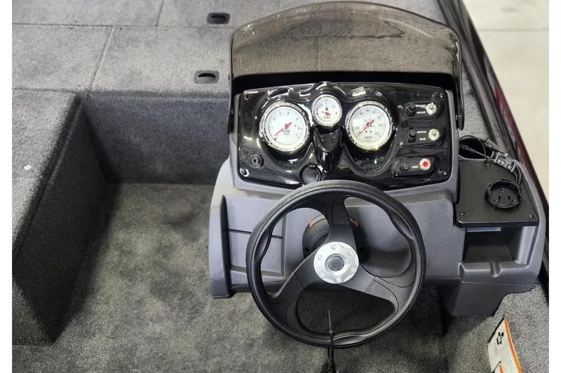 Slide: The Image of 2026 Tracker Pro 170 boat dashboard with steering wheel and gauges. - 5