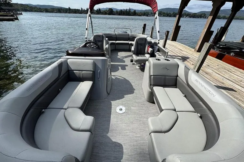 Slide: The Image of 2024 Bennington 22 SSRX with Yamaha 150 outboard motor on a pontoon boat. - 19
