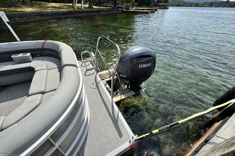 Slide: The Image of 2024 Bennington 22 SSRX boat interior with storage compartment and life jackets. - 20