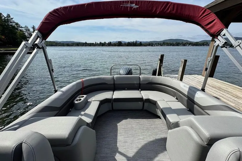 Slide: The Image of 2024 Bennington 22 SSRX pontoon boat interior with gray seating and cup holders. - 6