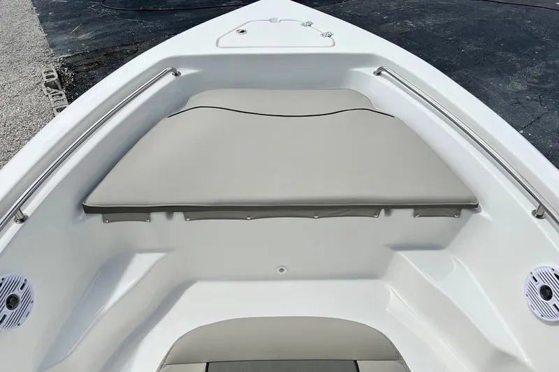 Slide: The Image of 2026 Key West 189 FS boat interior with cushioned seating and stainless steel rails. - 13