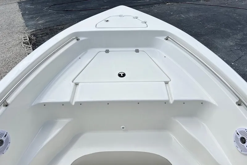 Slide: The Image of 2026 Key West 189 FS boat bow with storage compartment and stainless steel rails. - 14