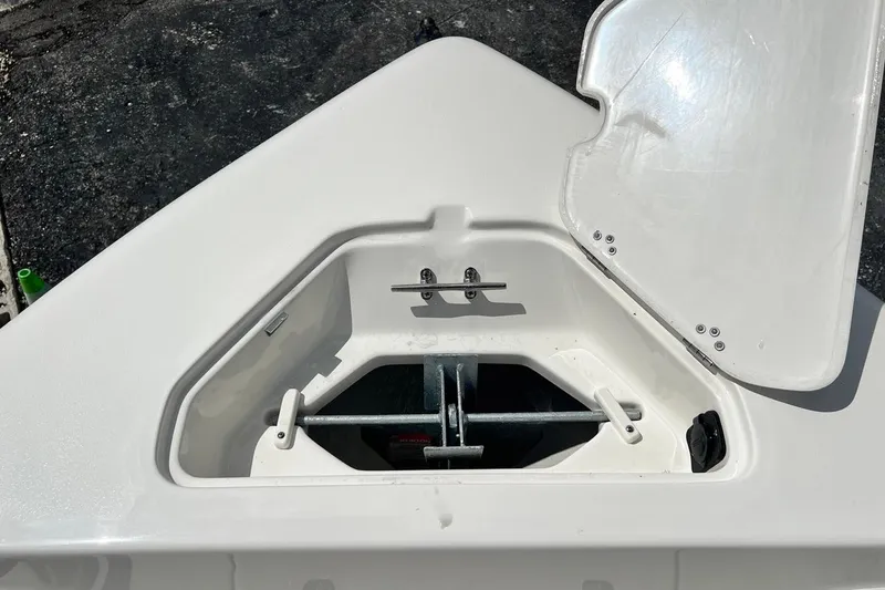 Slide: The Image of Open anchor compartment on 2026 Key West 189 FS boat, showcasing storage space. - 16