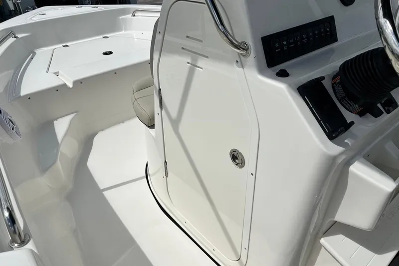 Slide: The Image of 2026 Key West 189 FS boat interior, featuring sleek white design and modern controls. - 25
