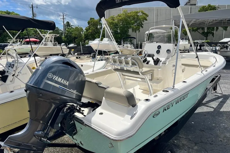 Slide: The Image of 2026 Key West 189 FS boat with Yamaha engine, parked outdoors. - 3