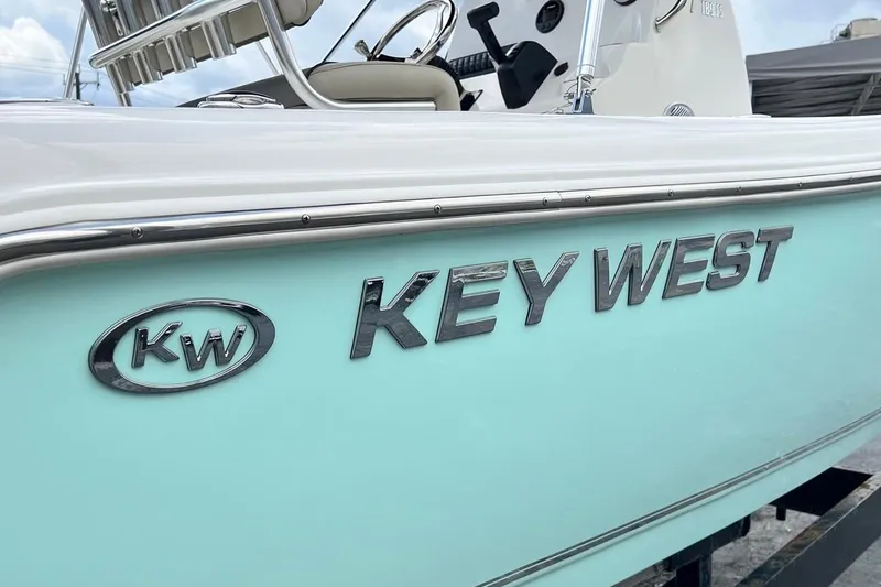 Slide: The Image of 2026 Key West 189 FS boat with sleek design and chrome logo detailing. - 30