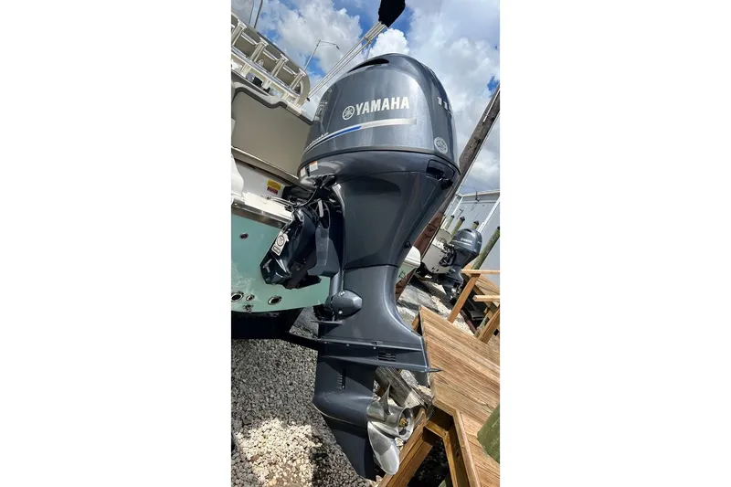 Slide: The Image of Yamaha outboard motor on 2026 Key West 189 FS boat, parked on gravel. - 5