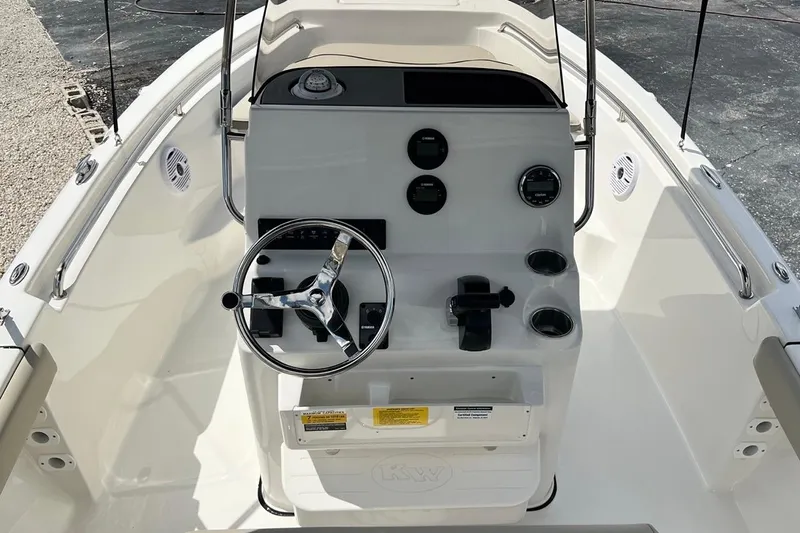Slide: The Image of 2026 Key West 189 FS boat console with steering wheel and gauges, featuring a sleek design. - 8