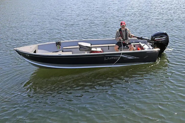 Slide: The Image of Manufacturer Provided Image: 2025 Lund 1600 Fury Tiller boat on water with person fishing. - 14