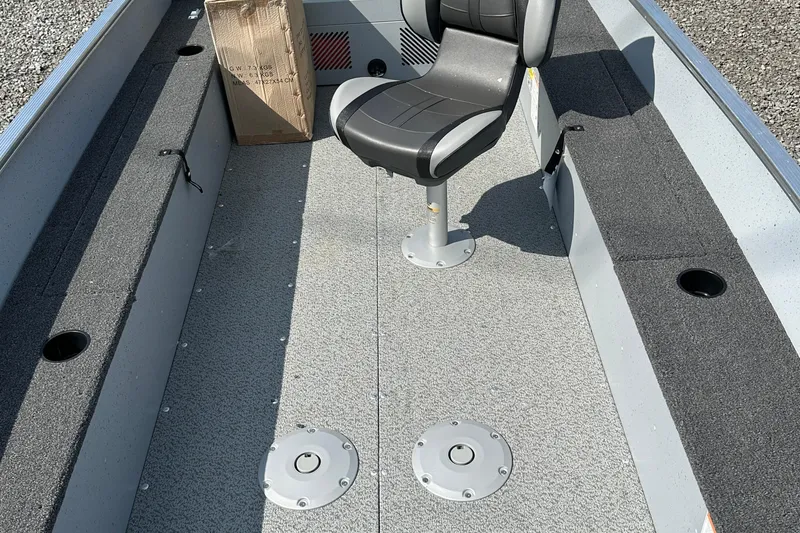 Slide: The Image of 2025 Lund 1600 Fury Tiller boat interior with seating and storage compartments. - 4