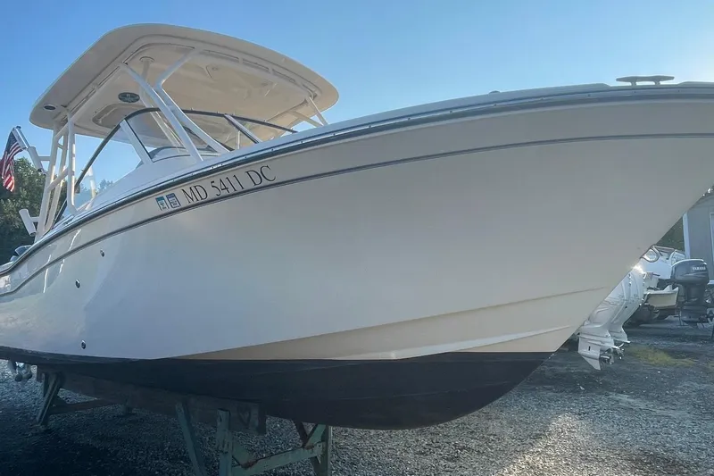 The Image of 2020 Grady-White Freedom 255 boat on display, side view with registration number visible. - 0