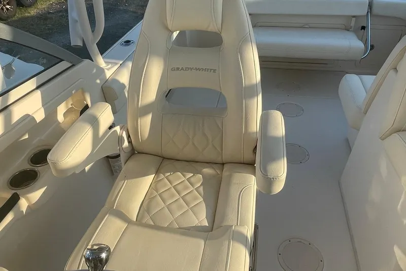 Slide: The Image of Luxurious seating on 2020 Grady-White Freedom 255 boat, featuring plush, cream-colored upholstery. - 5
