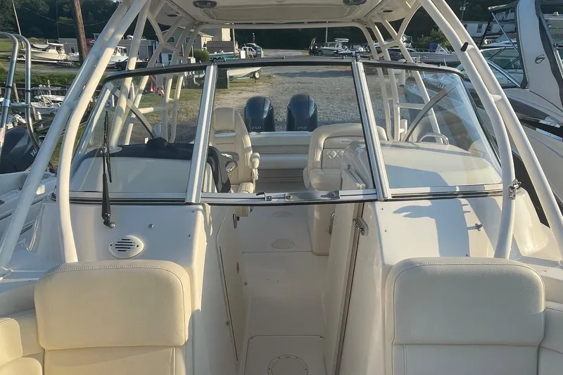 Slide: The Image of 2020 Grady-White Freedom 255 boat interior with dual engines and seating. - 7
