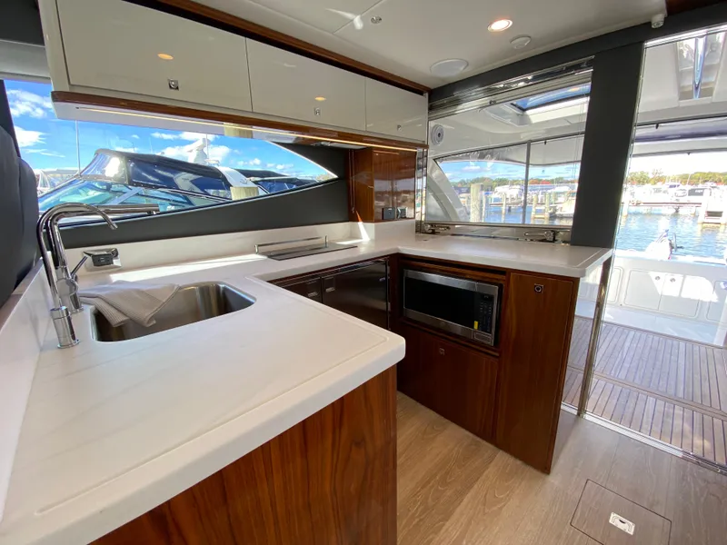 Slide: The Image of Luxurious 2025 Riviera 465 SUV yacht kitchen with modern appliances and sleek design. - 8