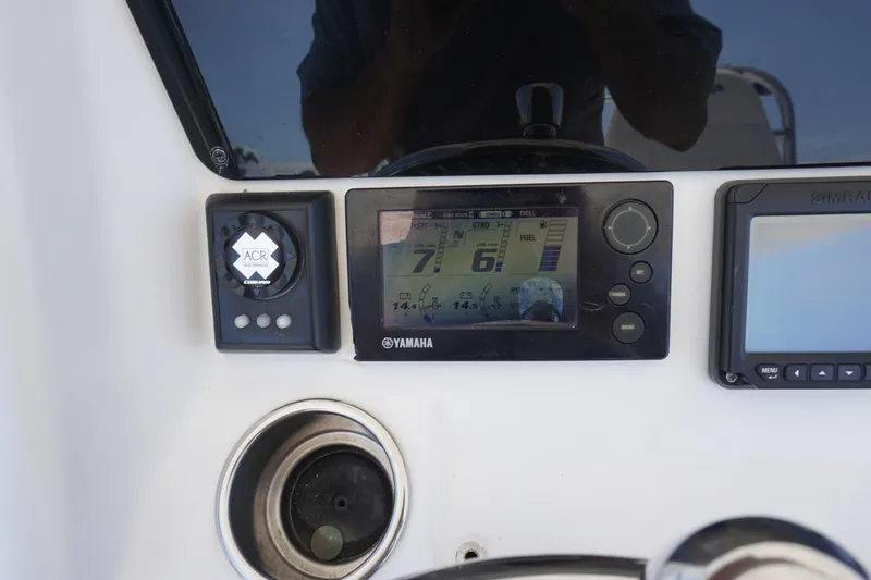 Slide: The Image of 2012 Regulator 32 Forward Seating dashboard with Yamaha display and controls. - 12