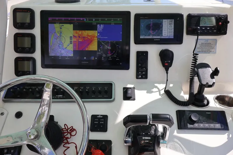Slide: The Image of Control panel of a 2015 Cobia 29’6 boat with navigation and communication equipment. - 3