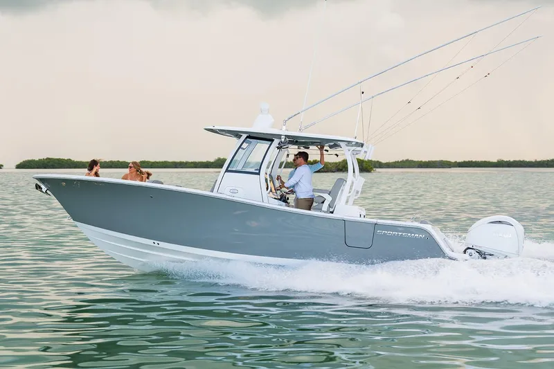 Slide: The Image of Manufacturer Provided Image: 2025 Sportsman Open 282 Center Console boat cruising on calm water. - 1
