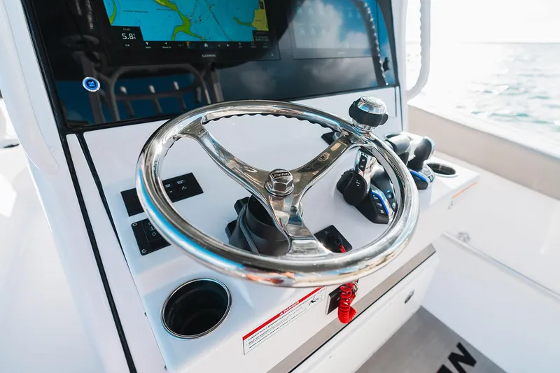 Slide: The Image of Manufacturer Provided Image: 2025 Sportsman Open 282 Center Console steering wheel and controls. - 12