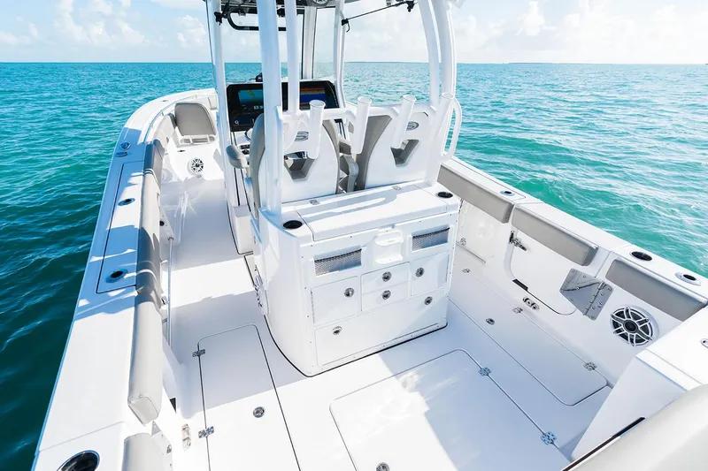 Slide: The Image of Manufacturer Provided Image: 2025 Sportsman Open 282 Center Console boat on clear blue water. - 13