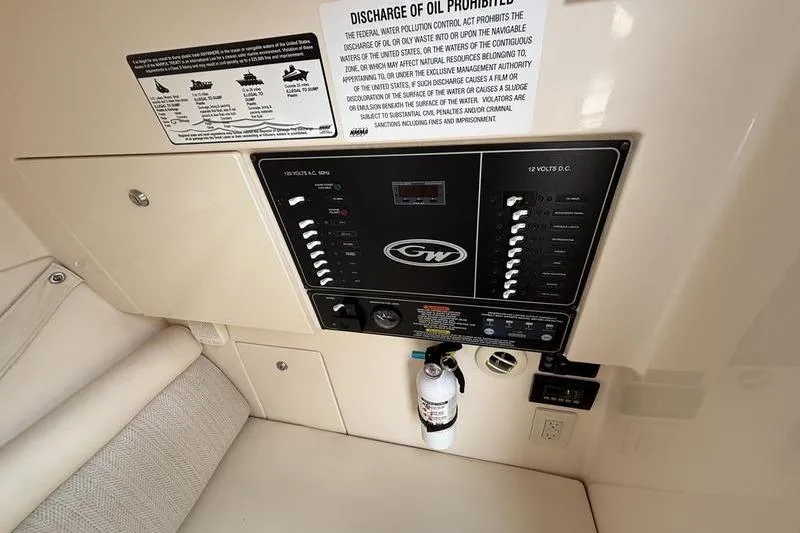 Slide: The Image of Control panel of 2018 Grady-White Freedom 325 boat with safety instructions. - 21