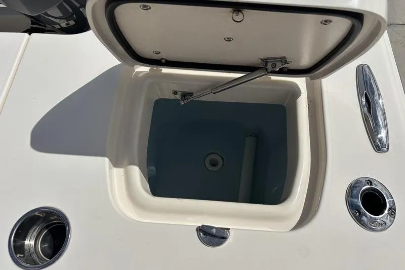 Slide: The Image of Open storage compartment on 2018 Grady-White Freedom 325 boat deck. - 25