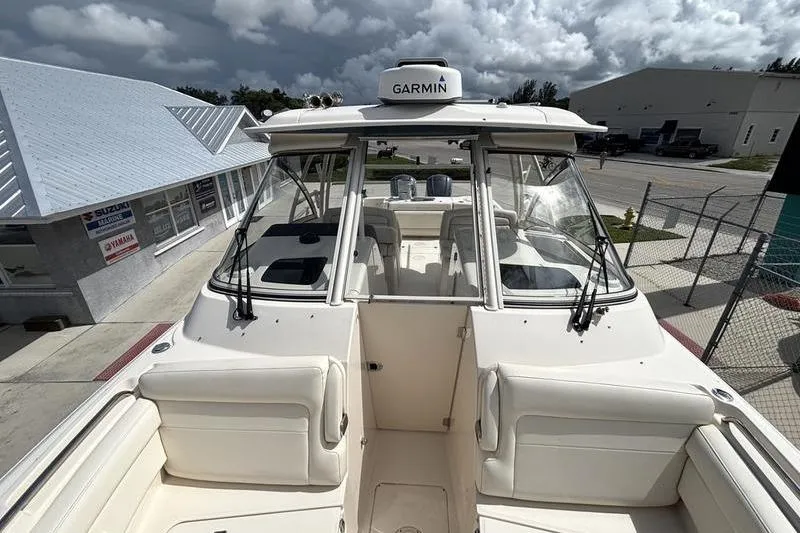 Slide: The Image of 2018 Grady-White Freedom 325 boat with Garmin equipment, docked under cloudy skies. - 8