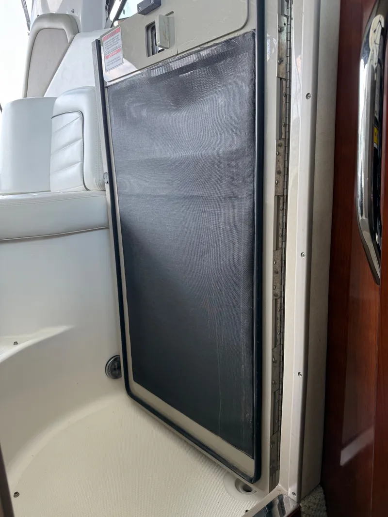 Slide: The Image of 2007 Sea Ray 290 Sundancer cabin interior with screen door detail. - 11