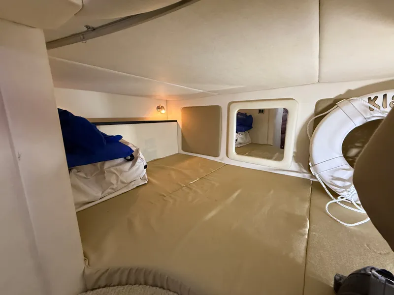 Slide: The Image of Interior cabin of 2007 Sea Ray 290 Sundancer with cushions and life preserver. - 12