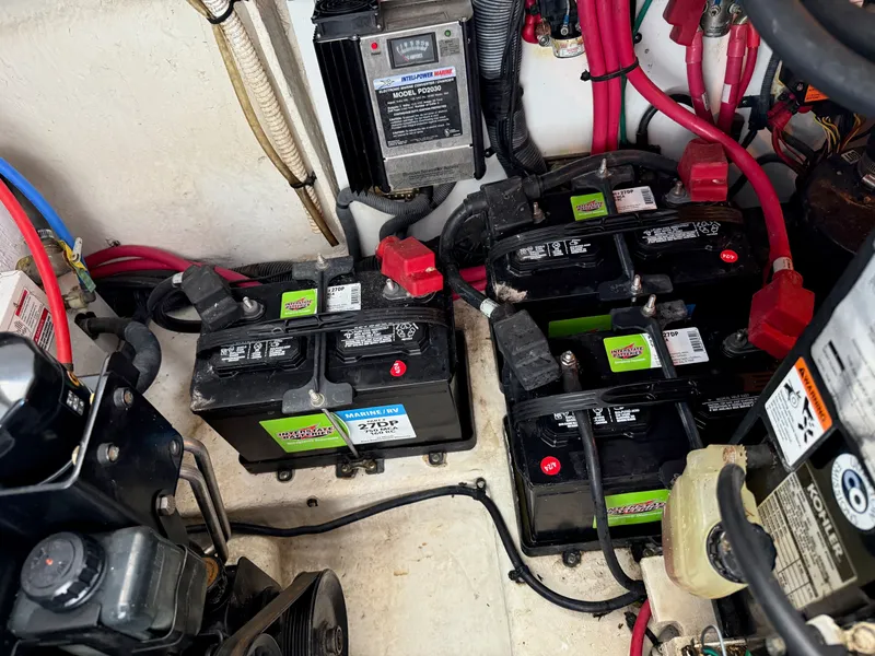 Slide: The Image of Engine compartment of a 2007 Sea Ray 290 Sundancer with batteries and wiring. - 17