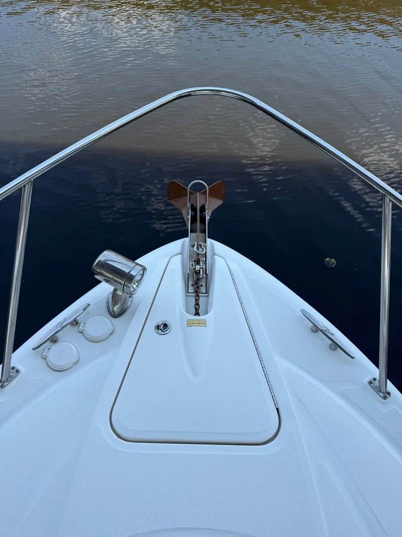 Slide: The Image of Bow of 2007 Sea Ray 290 Sundancer with anchor and calm water view. - 21