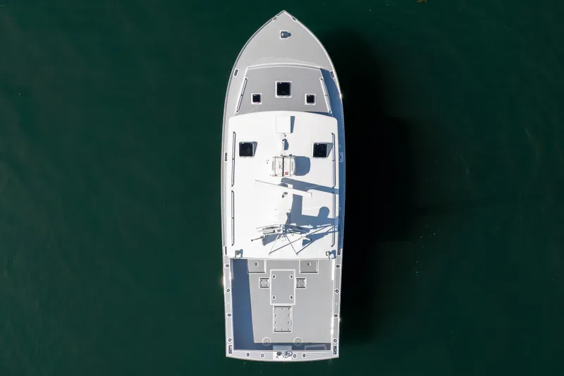 Slide: The Image of Aerial view of 2025 Mussel Ridge 42 boat on calm water. - 18