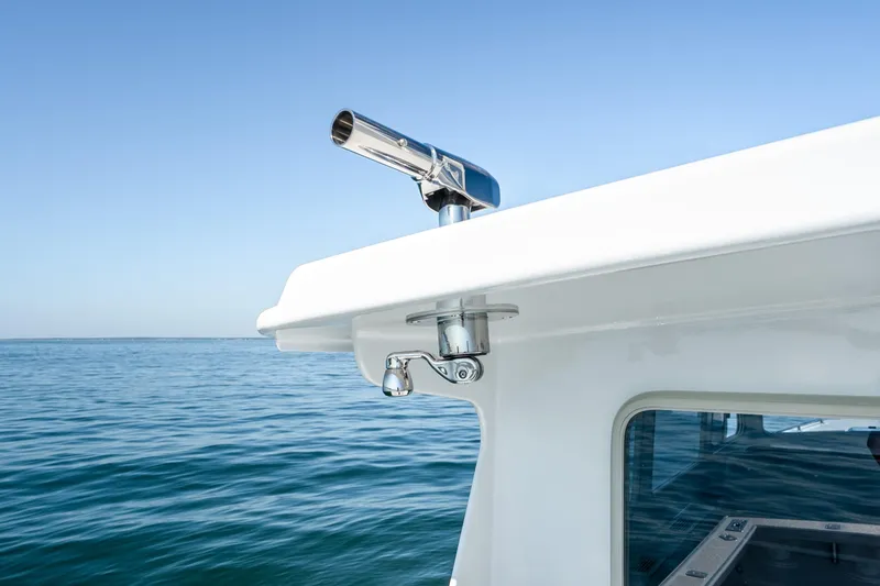 Slide: The Image of Mussel Ridge 42 boat detail, 2025 model, with ocean backdrop and clear sky. - 26