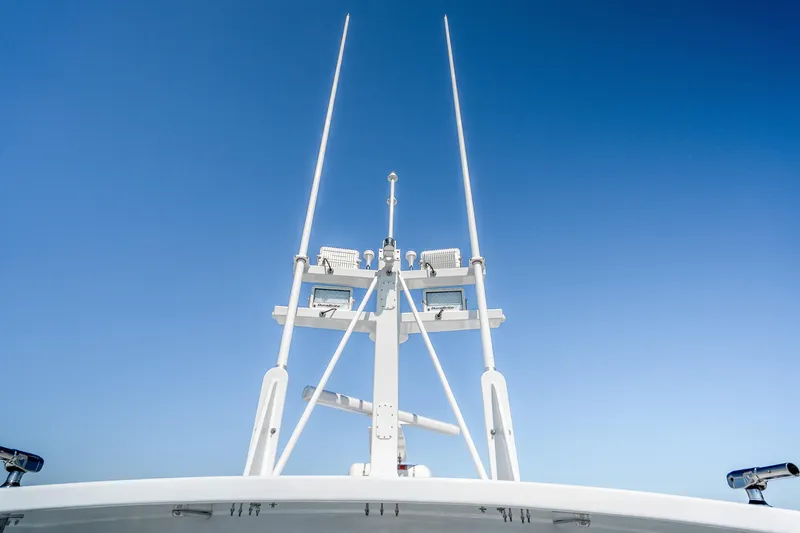 Slide: The Image of Mussel Ridge 42 boat antenna system against clear blue sky, 2025 model. - 30