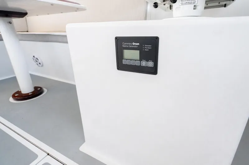 Slide: The Image of Control panel of Cummins Onan marine generator on 2025 Mussel Ridge 42 boat. - 41